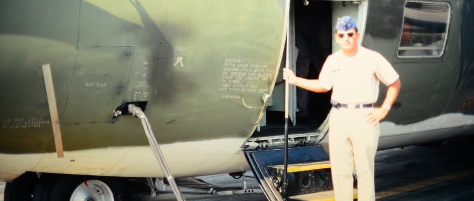 Richard Shine in uniform at the open door of a military cargo plane